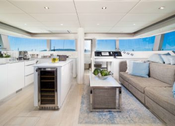 Solitaire Modern Sailing Catamaran Charter Croatia indoor modern couch and kitchen in yacht - High Point Yachting
