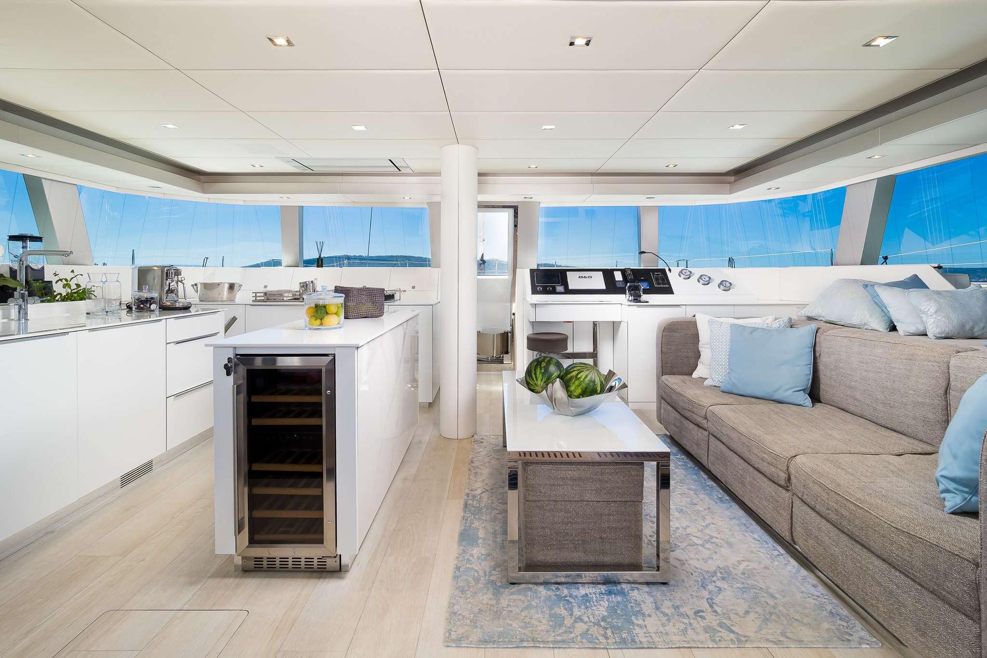 Solitaire Modern Sailing Catamaran Charter Croatia indoor modern couch and kitchen in yacht - High Point Yachting