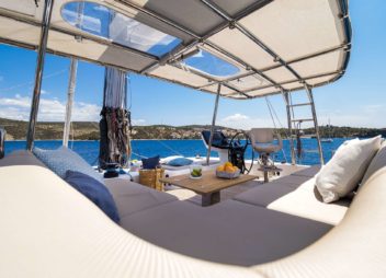 Solitaire Modern Sailing Catamaran Charter Croatia modern couch and variety fruits - High Point Yachting