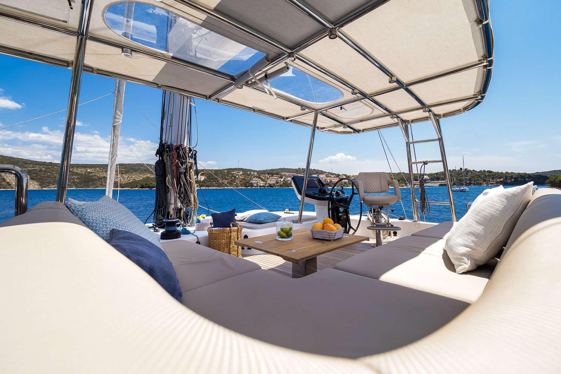 Solitaire Modern Sailing Catamaran Charter Croatia modern couch and variety fruits - High Point Yachting