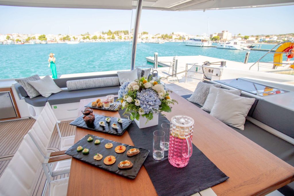fine dining indoor on catamaran charter luxury food - High Point Yachting