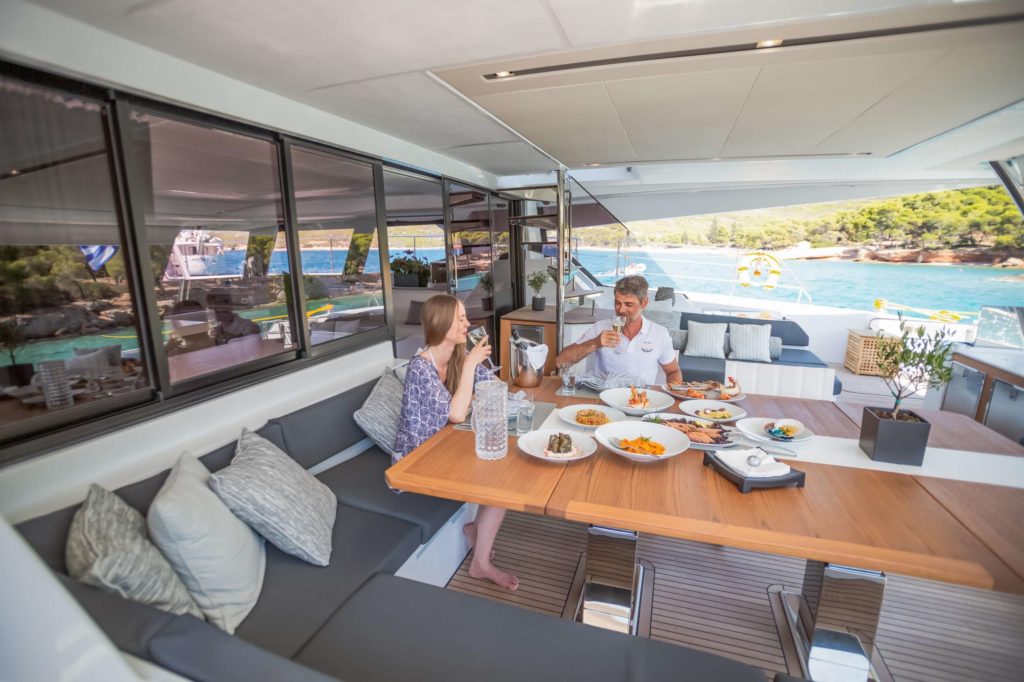 ChristAl MiO Luxurious & Spacious Motor Catamaran Spending good time lunch on charter - High Point Yachting