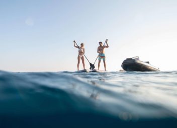 Family paddle board in greece with yacht charter experts - High Point Yachting