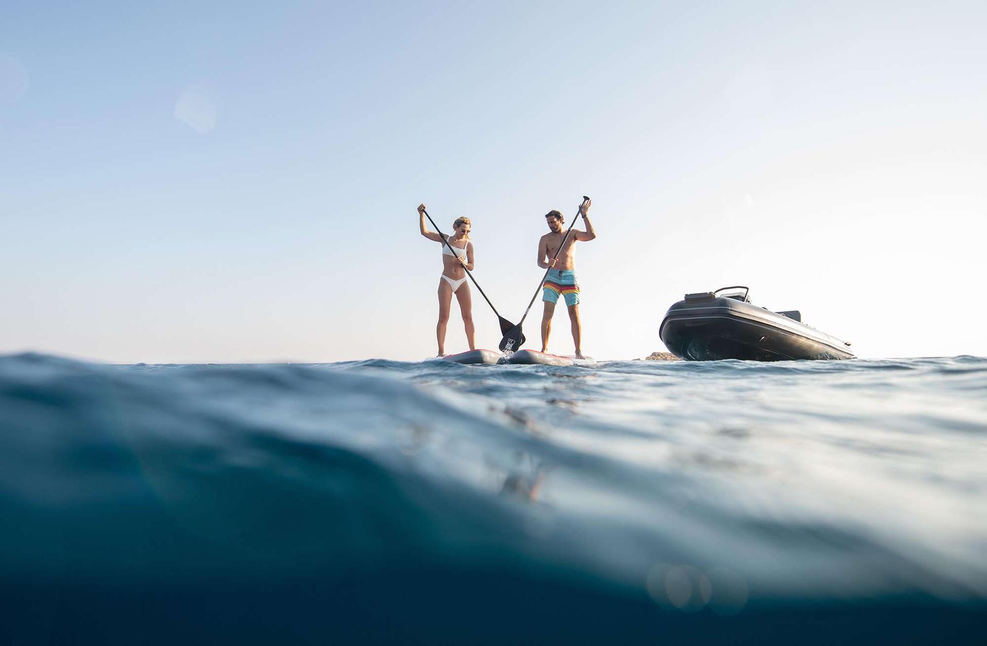 Family paddle board in greece with yacht charter experts - High Point Yachting