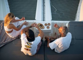 Small Family Sailing vacation on yacht charter having light breakfast - High Point Yachting