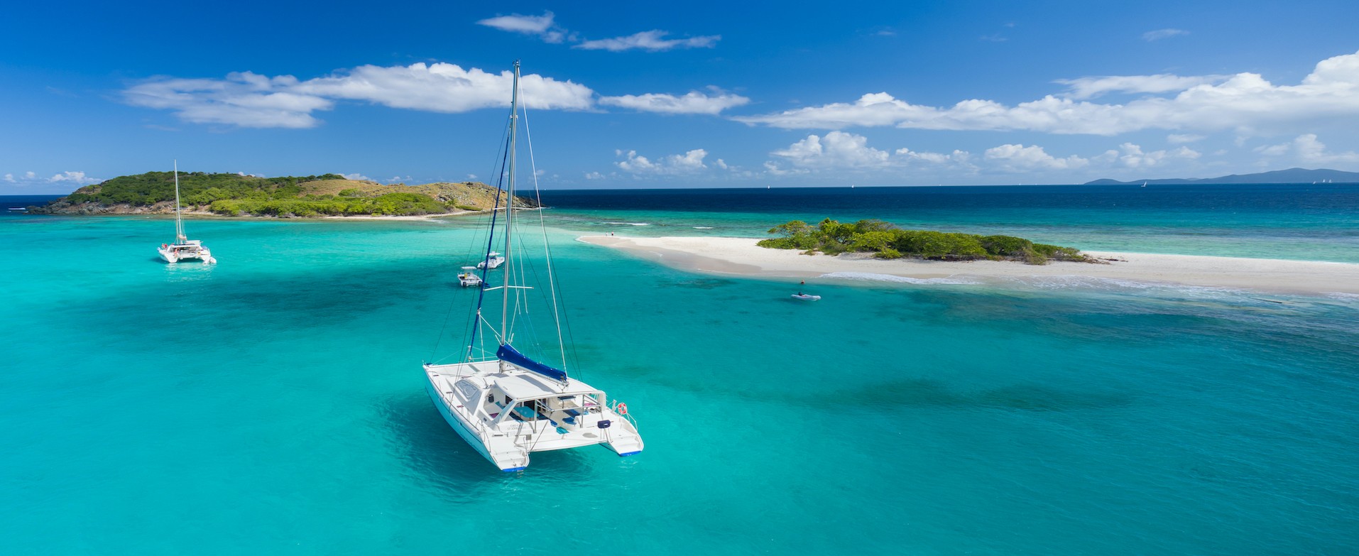 Aerial view of a catamaran at anchor in front of Sandy Spit, British Virgin Islands, Caribbean