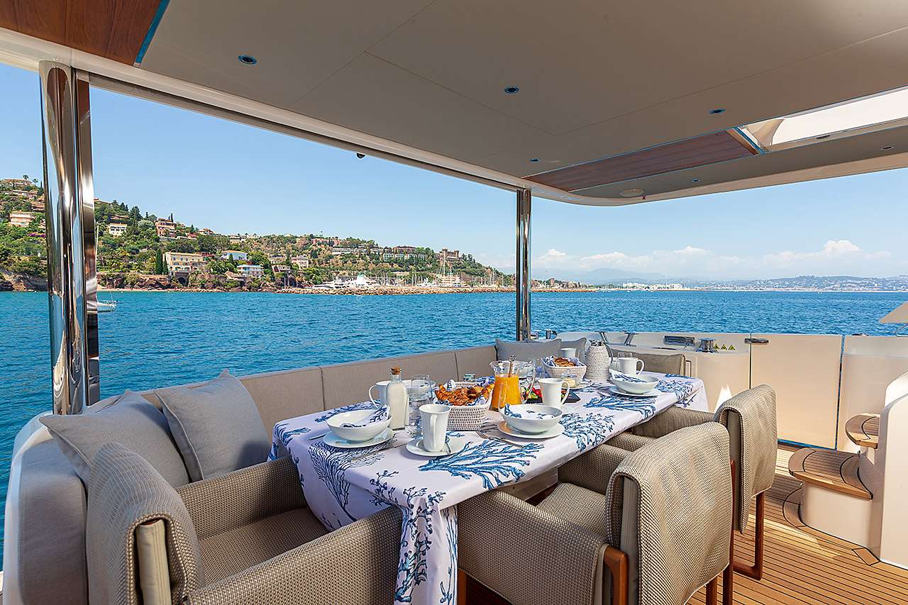 Charter Enigma in Italy, Sardina, Corsica & French a luxury modern yacht fine dining with sea view on yacht- High Point Yachting