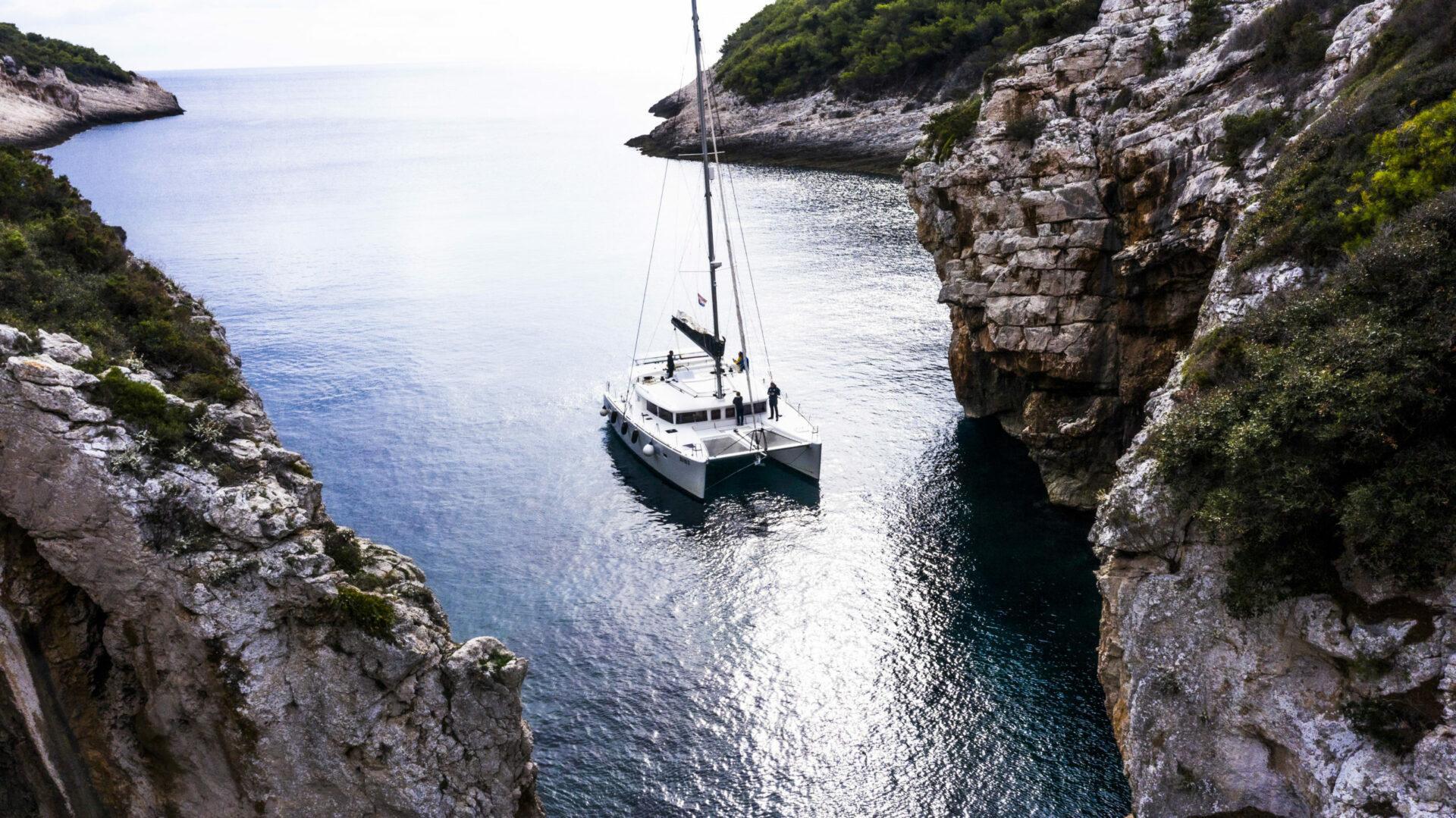 Sailing catamaran Marla in a bay